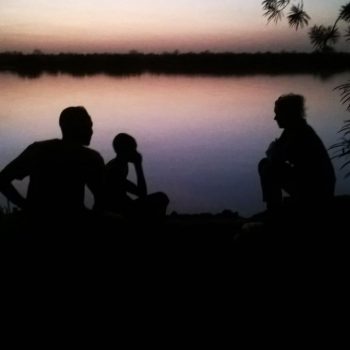 Wassu by night talking to locals at the riverside